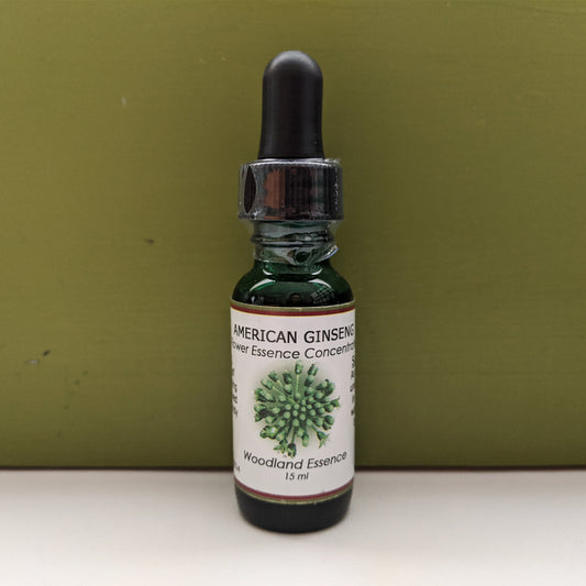 American Ginseng Flower Essence bottle against green back drop