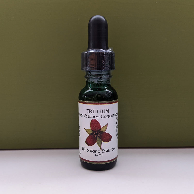 Bottle of Trillium Flower Essence against green background 