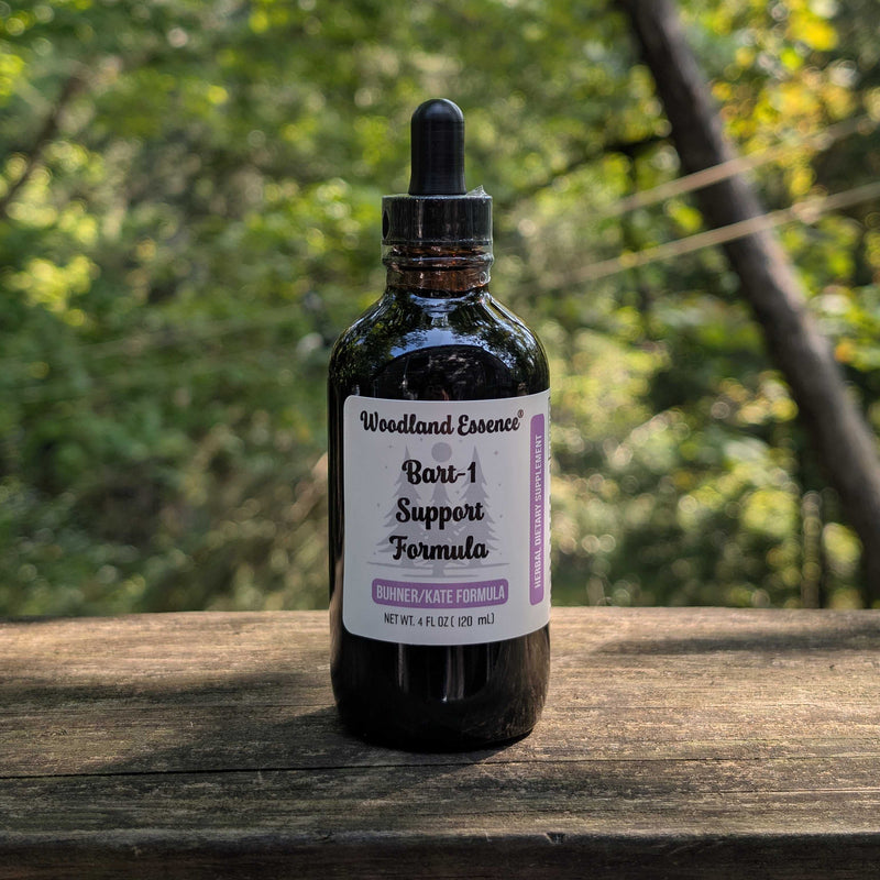 Bottle of Woodland Essence Bart-1 Support Formula on a wooden surface with a natural background