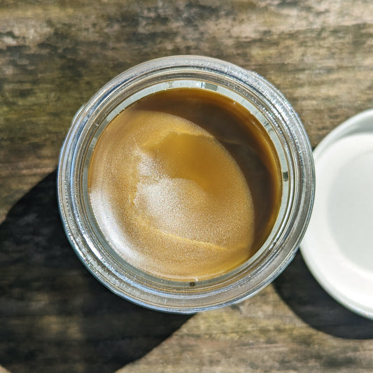 open jar of black walnut salve 