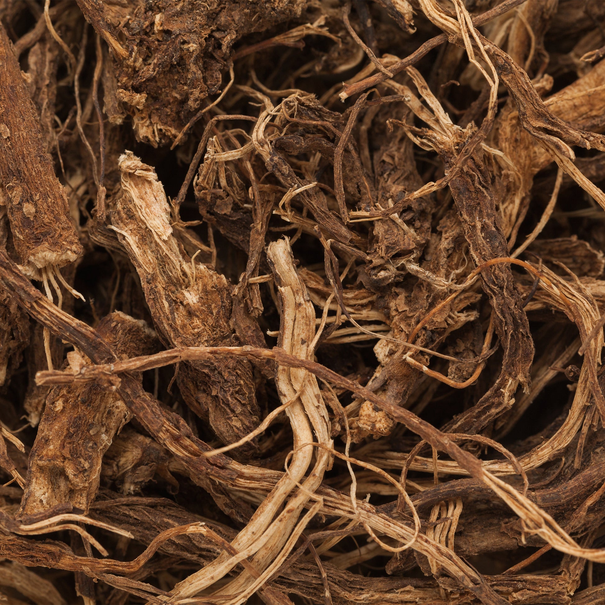 Close-up of dried herbs or roots with a brown color.
