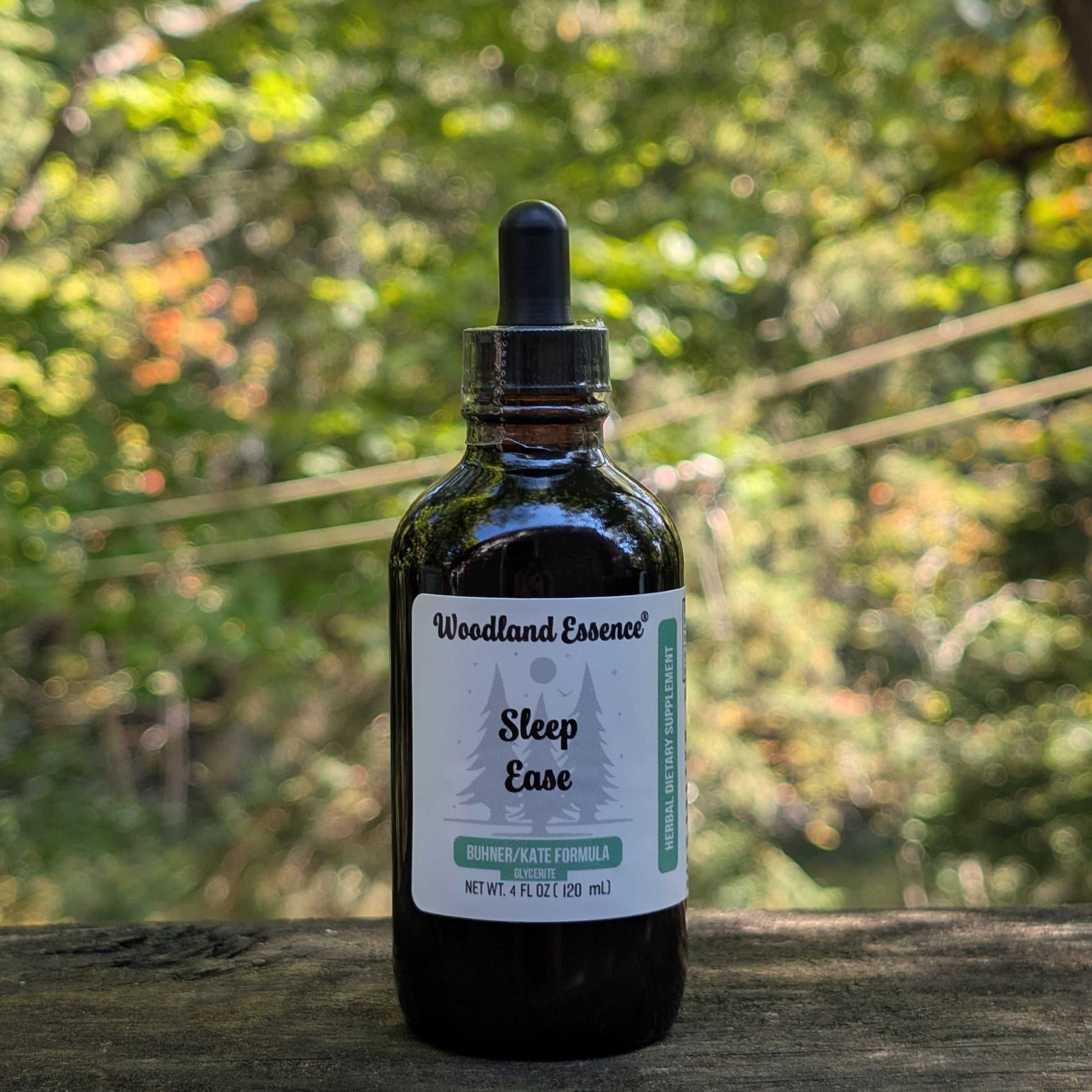 Bottle of Woodland Essence Sleep Ease tincture with a natural background