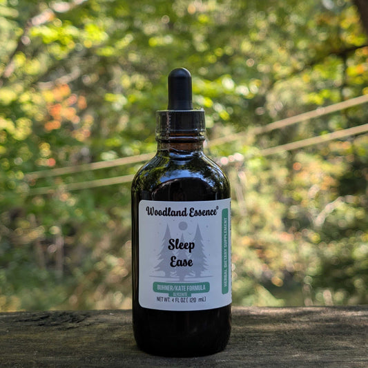 Bottle of Woodland Essence Sleep Ease tincture with a natural background