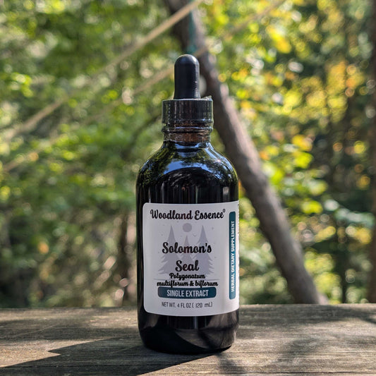Bottle of Woodland Essence Solomon's Seal extract on a wooden surface with a natural background