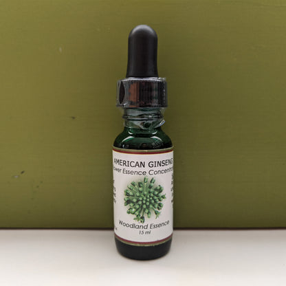 American Ginseng Flower Essence bottle against green back drop 
