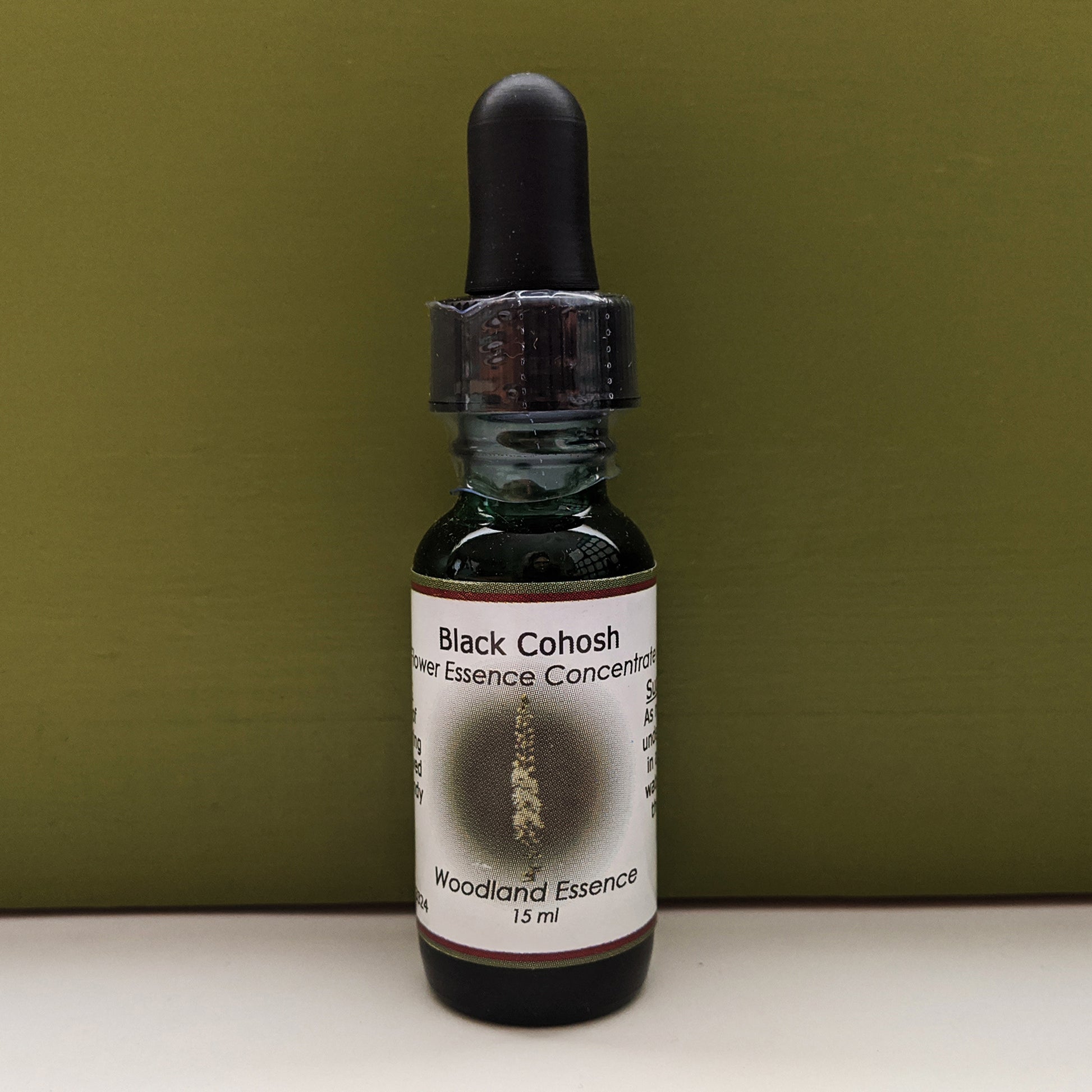 Black Cohosh Flower Essence bottle against green background 