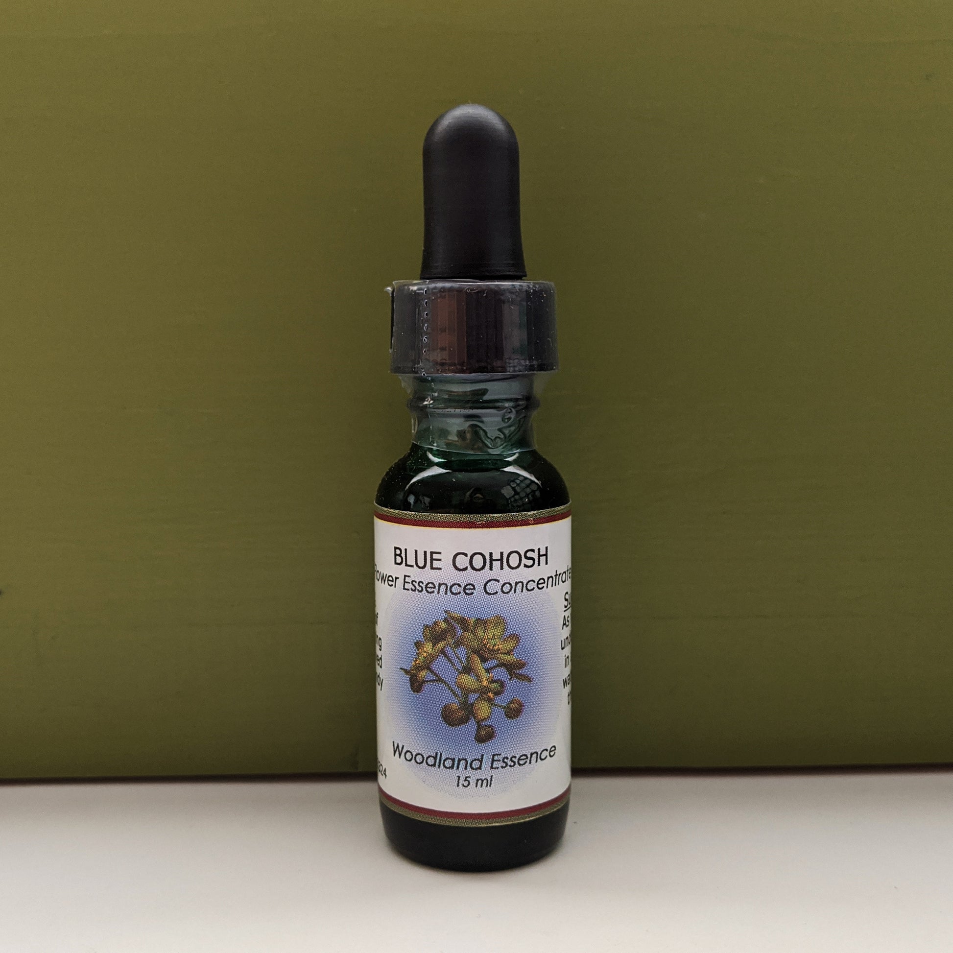 Blue Cohosh Flower Essence bottle against green background 
