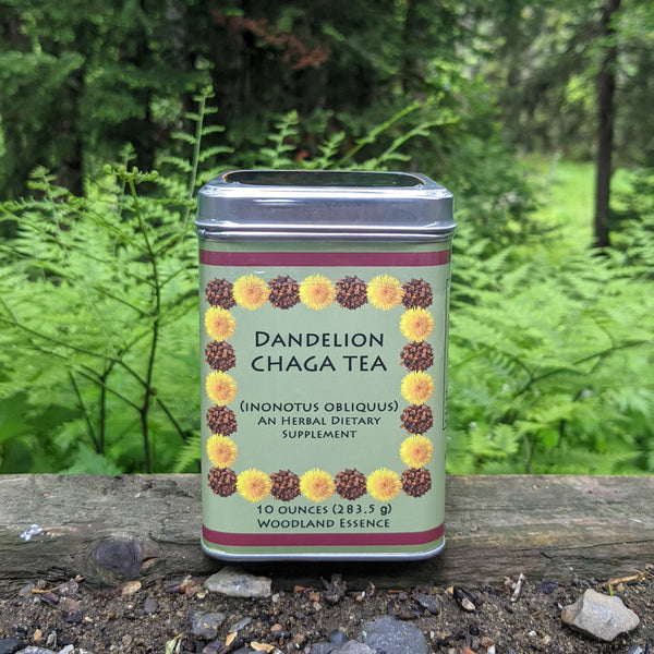 10 oz Dandelion Chaga Tea tin against woods background 