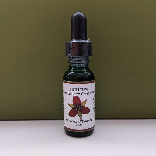 Bottle of Trillium Flower Essence against green background 