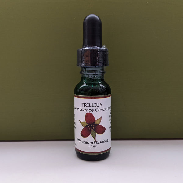 Bottle of Trillium Flower Essence against green background 